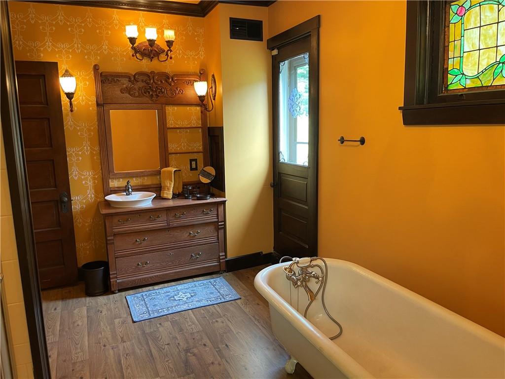 244 West Pearl Street Butler, PA 16001 - Photo 13 of 25 a bathroom with a tub sink and mirror