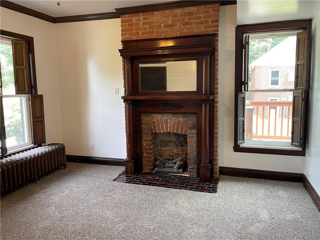 244 West Pearl Street Butler, PA 16001 - Photo 14 of 25 a living room with a fireplace