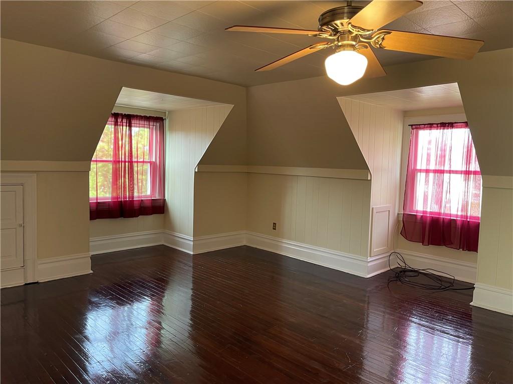 244 West Pearl Street Butler, PA 16001 - Photo 19 of 25 a view of an empty room with wooden floor and window