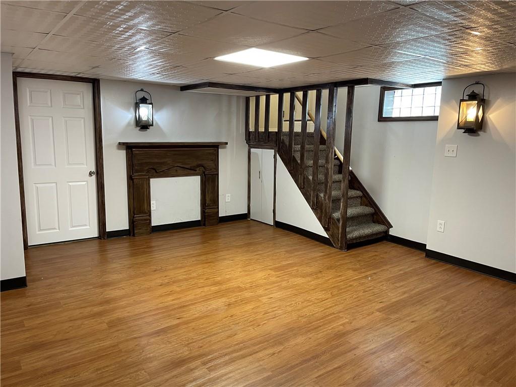 244 West Pearl Street Butler, PA 16001 - Photo 22 of 25 a view of an empty room with wooden floor fireplace and a window