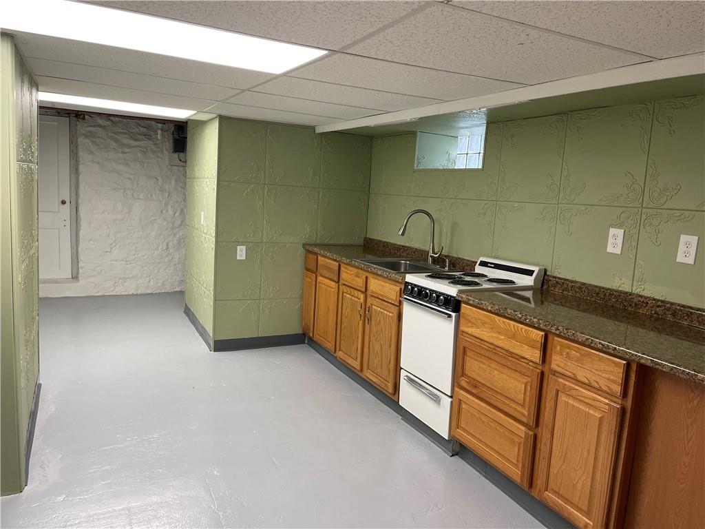 244 West Pearl Street Butler, PA 16001 - Photo 23 of 25 a kitchen with stainless steel appliances granite countertop a sink a stove and a refrigerator