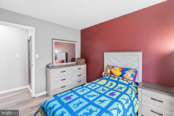 a bathroom with a sink mirror toilet and shower