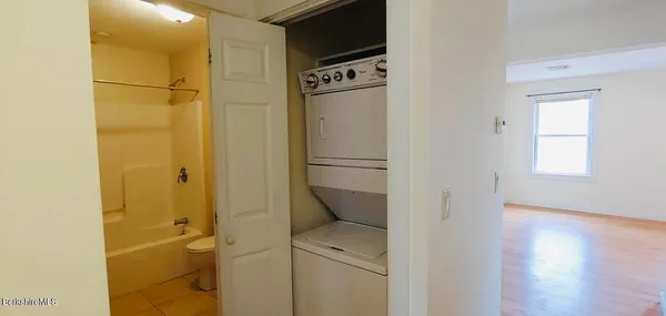a view of bathroom with a shower a sink and a toilet