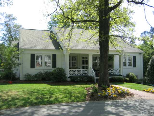 1306 Rand Drive Raleigh, NC 27608 - Photo 1 of 12 a front view of a house with garden