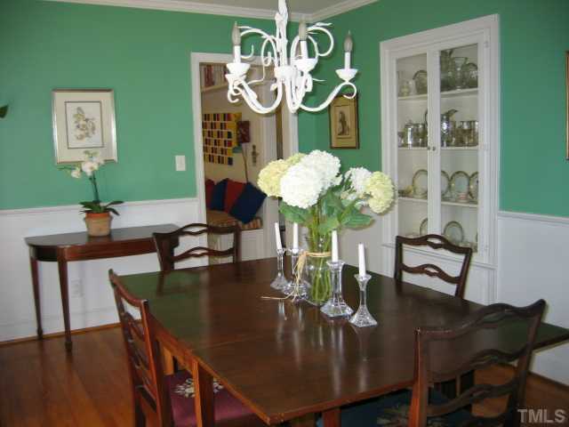 1306 Rand Drive Raleigh, NC 27608 - Photo 5 of 12 a view of a dining room with furniture and wooden floor