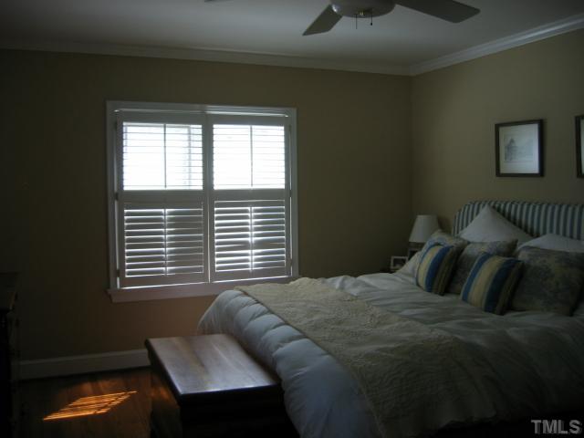 1306 Rand Drive Raleigh, NC 27608 - Photo 7 of 12 a bedroom with a bed and window