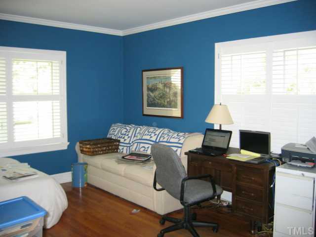 1306 Rand Drive Raleigh, NC 27608 - Photo 10 of 12 a living room with furniture and a window