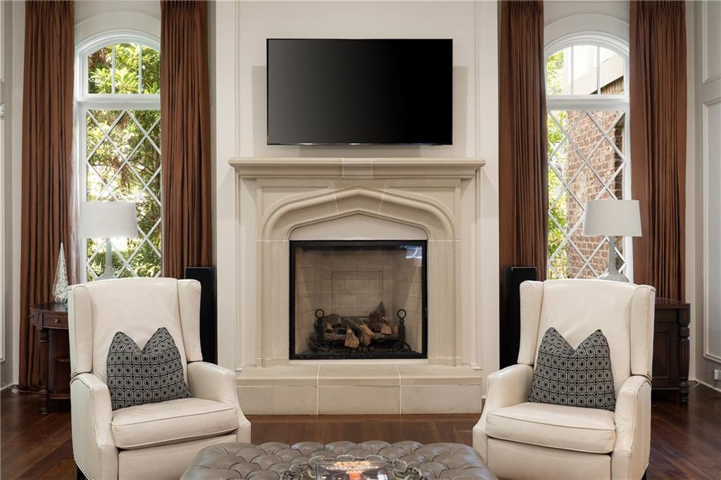 4136 North Stratford Road Northeast Atlanta, GA 30342 - Photo 11 of 78 a living room with furniture a flat screen tv and a fireplace