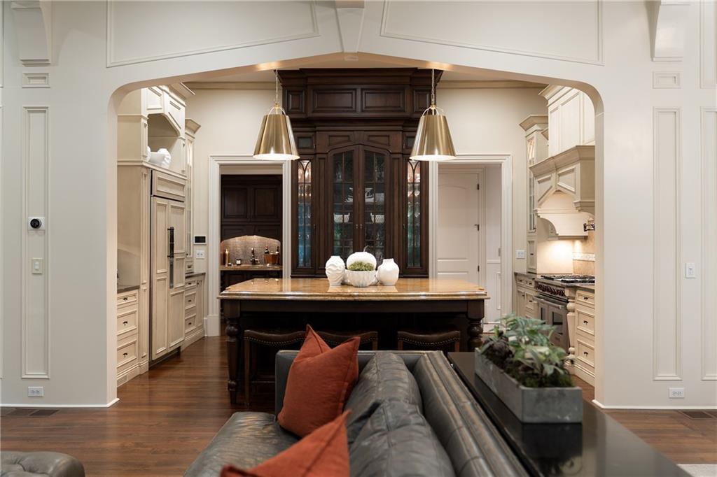 4136 North Stratford Road Northeast Atlanta, GA 30342 - Photo 15 of 78 a dining room with furniture and wooden floor