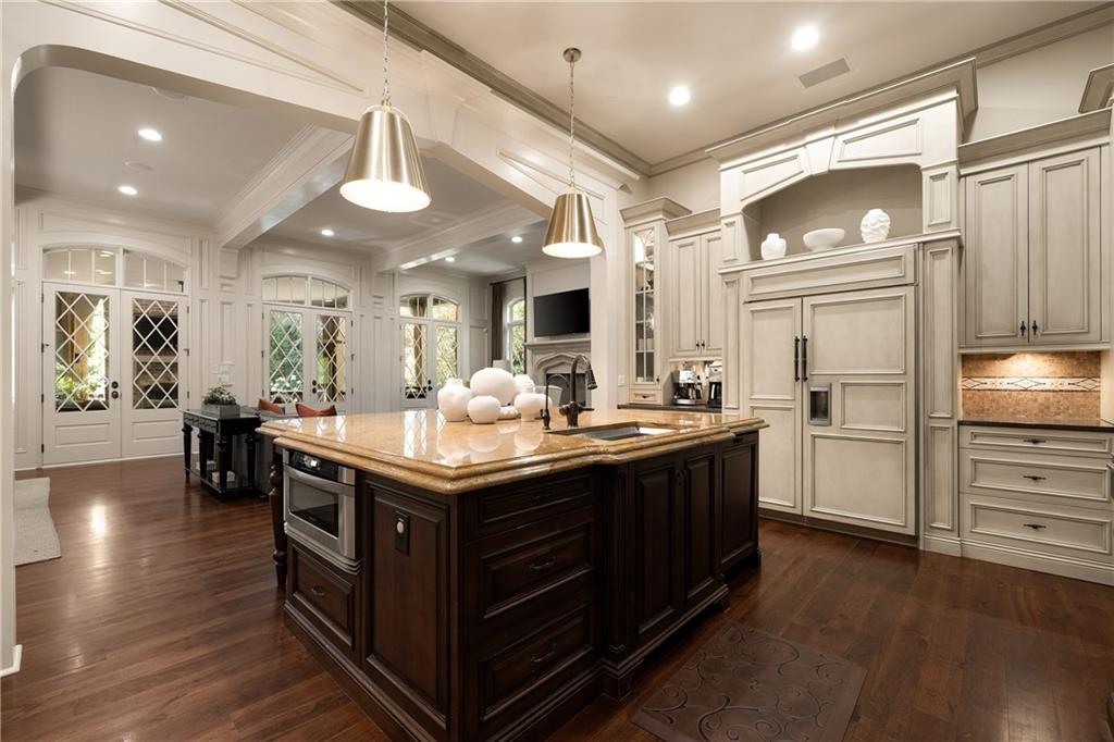 4136 North Stratford Road Northeast Atlanta, GA 30342 - Photo 16 of 78 a kitchen with stainless steel appliances granite countertop a stove and a refrigerator