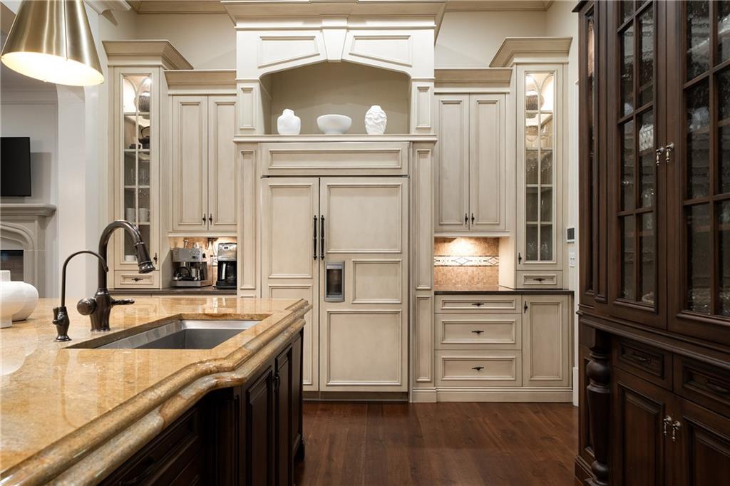 4136 North Stratford Road Northeast Atlanta, GA 30342 - Photo 17 of 78 a kitchen with granite countertop a refrigerator stove and sink
