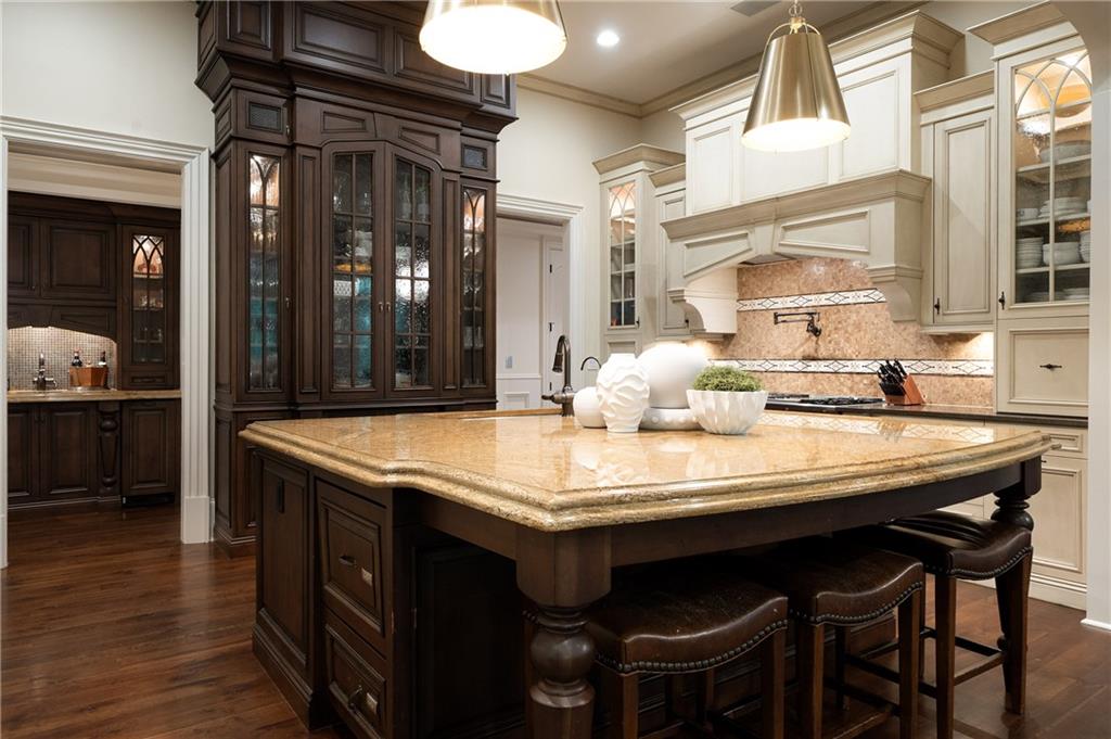 4136 North Stratford Road Northeast Atlanta, GA 30342 - Photo 21 of 78 a dining table with chairs and cabinets