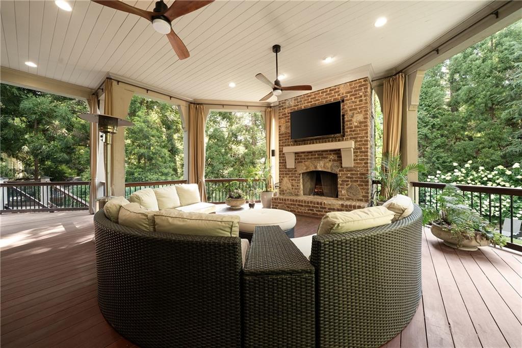 4136 North Stratford Road Northeast Atlanta, GA 30342 - Photo 23 of 78 a living room with fireplace furniture and a flat screen tv