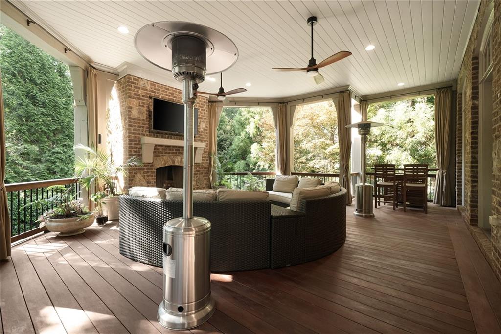 4136 North Stratford Road Northeast Atlanta, GA 30342 - Photo 25 of 78 a living room with furniture and a fireplace