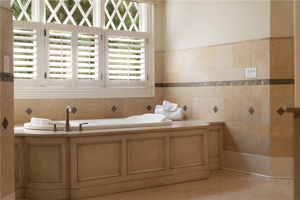 4136 North Stratford Road Northeast Atlanta, GA 30342 - Photo 37 of 78 a bathroom with a sink and a window