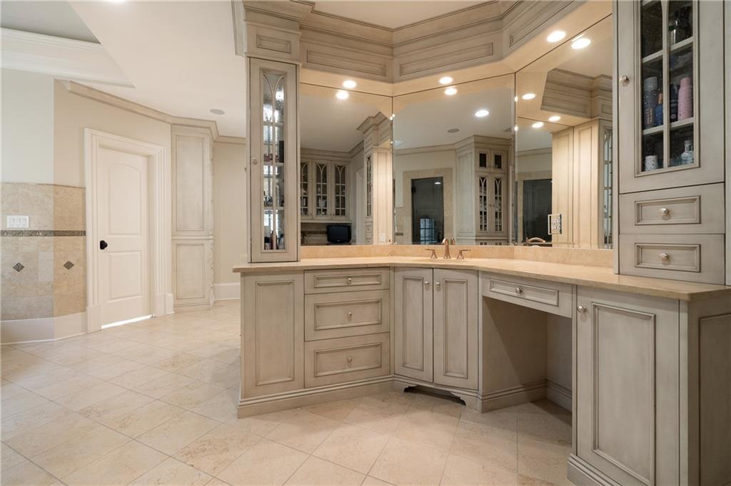 4136 North Stratford Road Northeast Atlanta, GA 30342 - Photo 38 of 78 a bathroom with a sink vanity and mirror