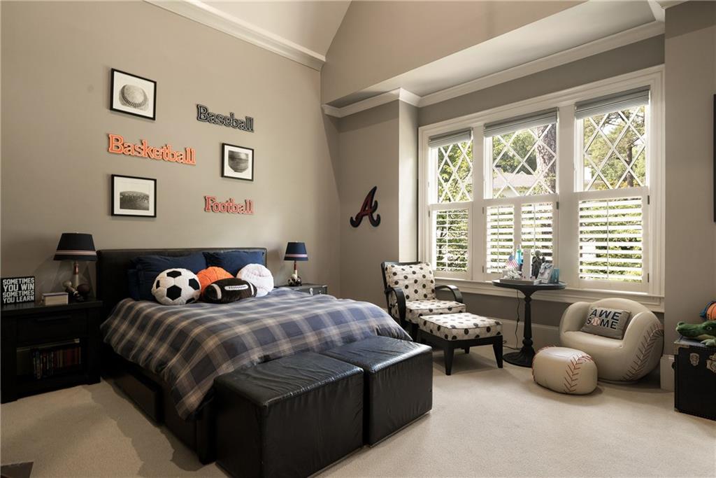 4136 North Stratford Road Northeast Atlanta, GA 30342 - Photo 42 of 78 a bedroom with bed couch and window