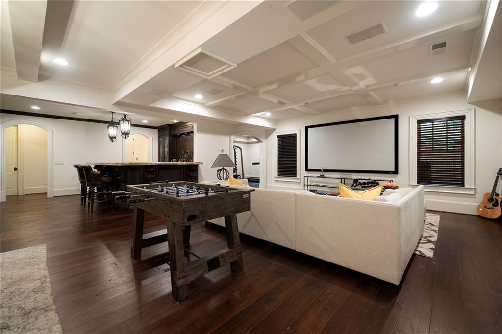 4136 North Stratford Road Northeast Atlanta, GA 30342 - Photo 48 of 78 a living room with furniture and a flat screen tv