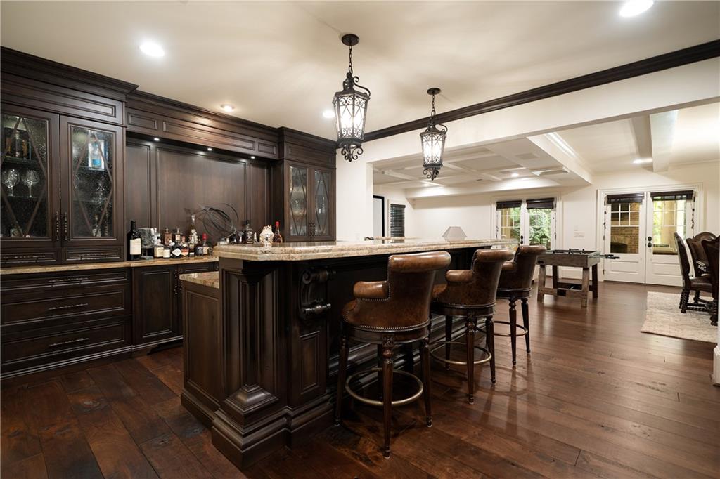 4136 North Stratford Road Northeast Atlanta, GA 30342 - Photo 51 of 78 a kitchen with lots of counter top space and painting on the wall
