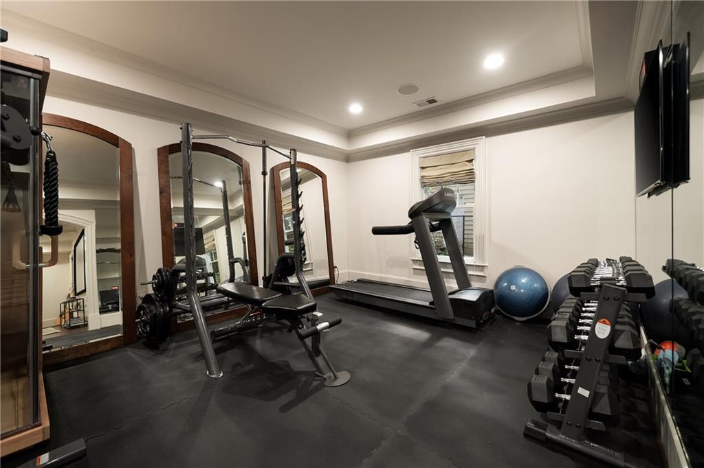4136 North Stratford Road Northeast Atlanta, GA 30342 - Photo 57 of 78 a room with gym equipment