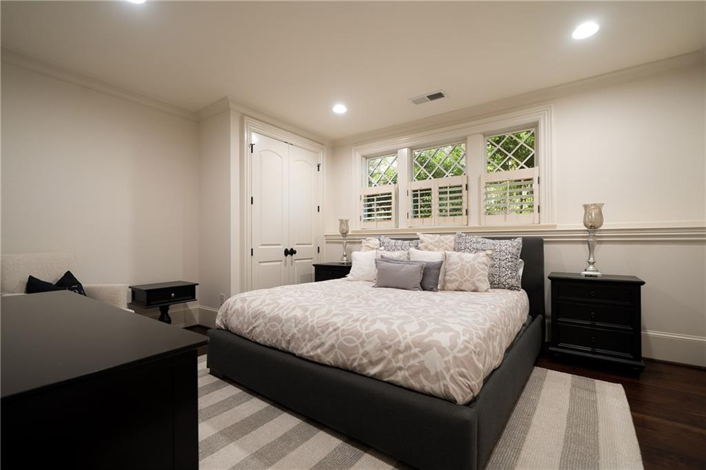 4136 North Stratford Road Northeast Atlanta, GA 30342 - Photo 60 of 78 a bedroom with a bed and a window