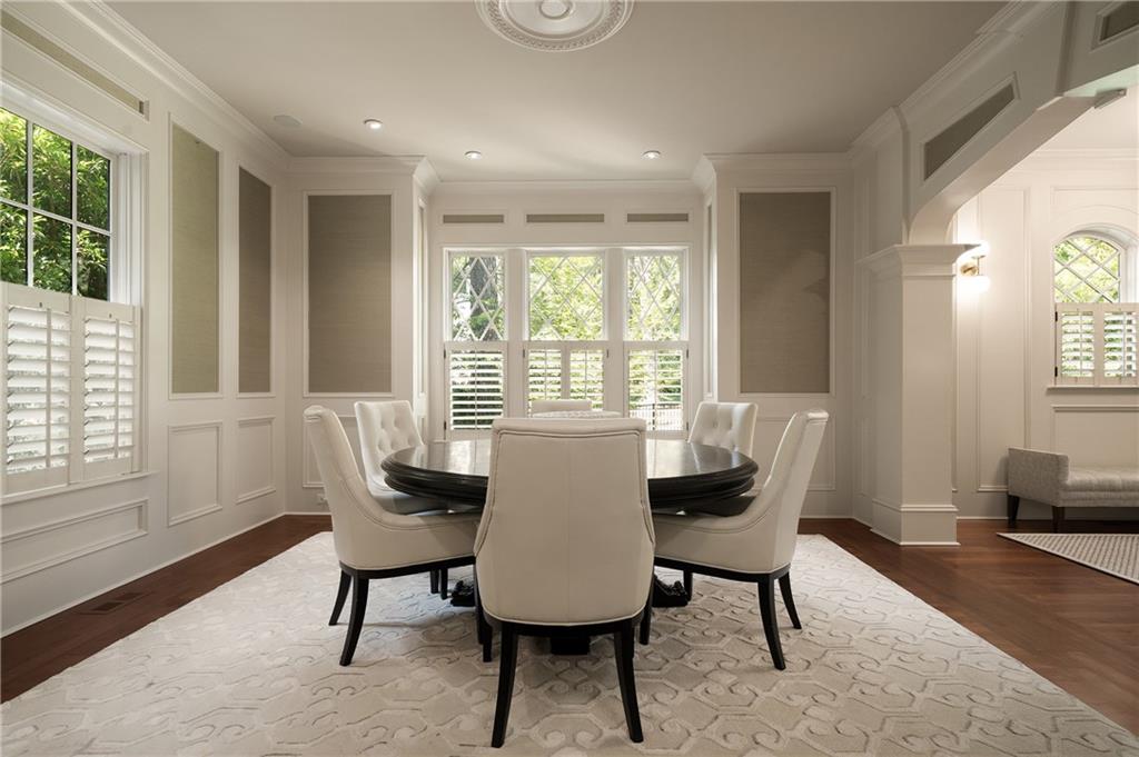 4136 North Stratford Road Northeast Atlanta, GA 30342 - Photo 7 of 78 a view of a dining room with furniture window and wooden floor