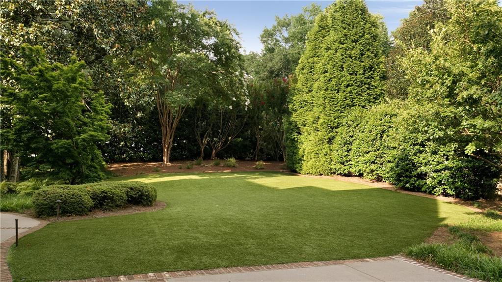 4136 North Stratford Road Northeast Atlanta, GA 30342 - Photo 74 of 78 a view of a trees with a yard