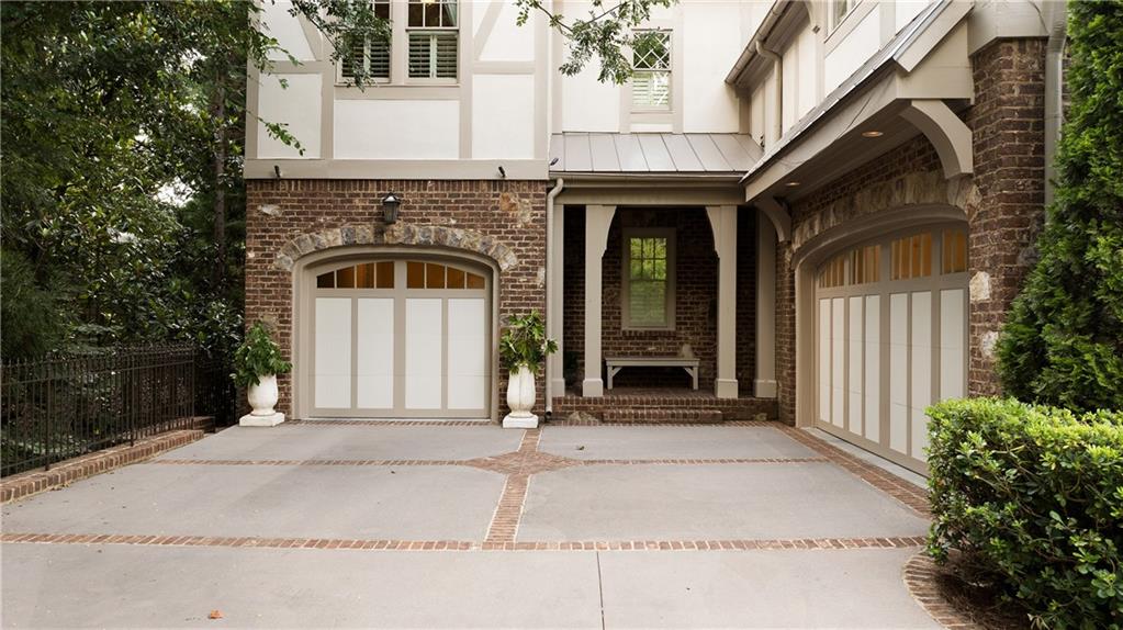 4136 North Stratford Road Northeast Atlanta, GA 30342 - Photo 75 of 78 a front view of a house with a garage