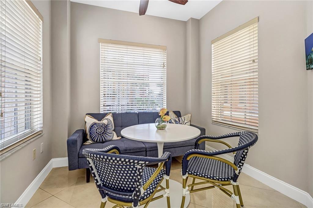 410 Bayfront Place, Unit 2208 Naples, FL 34102 - Photo 11 of 26 a living room with furniture a window and a table