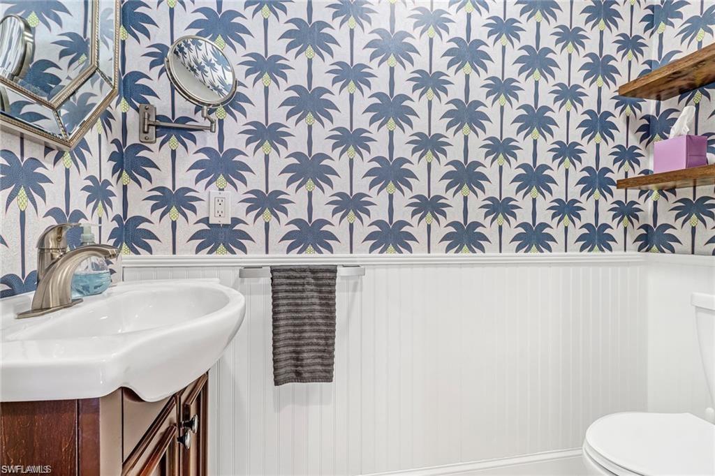 410 Bayfront Place, Unit 2208 Naples, FL 34102 - Photo 12 of 26 a bathroom with a sink and a mirror