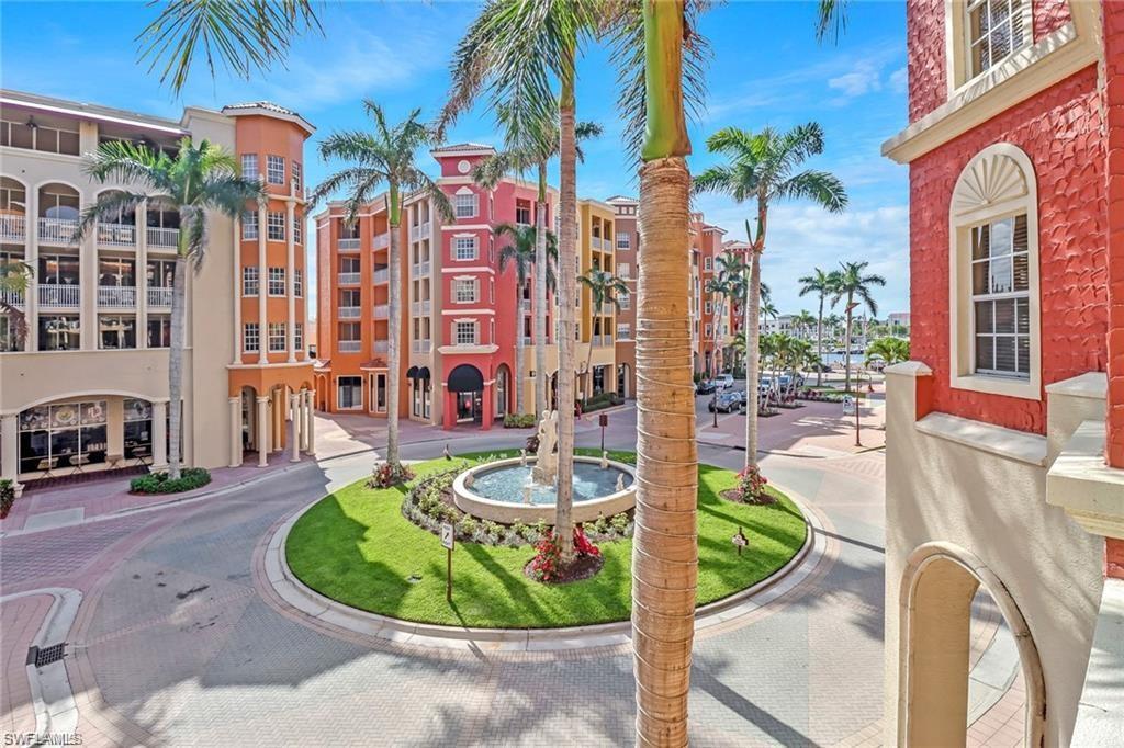 410 Bayfront Place, Unit 2208 Naples, FL 34102 - Photo 13 of 26 a swimming pool with outdoor seating and yard