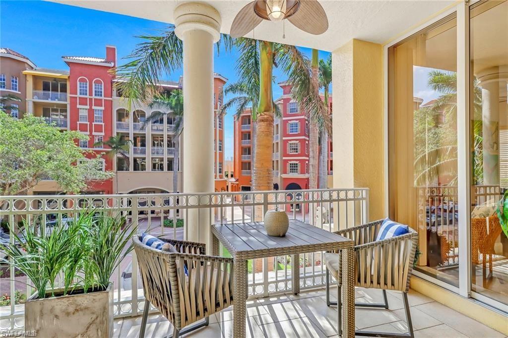 410 Bayfront Place, Unit 2208 Naples, FL 34102 - Photo 14 of 26 a front view of a house with outdoor seating