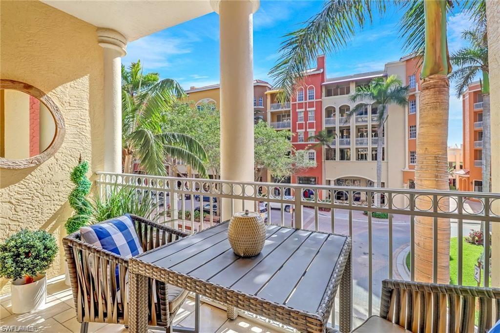 410 Bayfront Place, Unit 2208 Naples, FL 34102 - Photo 16 of 26 a view of a balcony with two chairs and a table