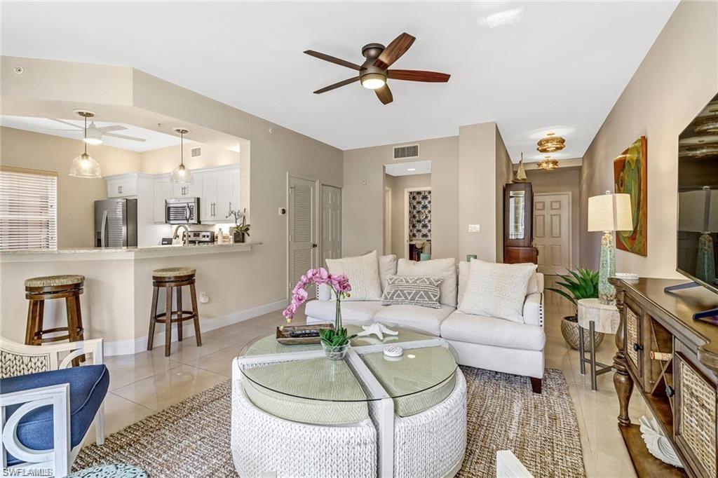 410 Bayfront Place, Unit 2208 Naples, FL 34102 - Photo 3 of 26 a living room with furniture and a large window