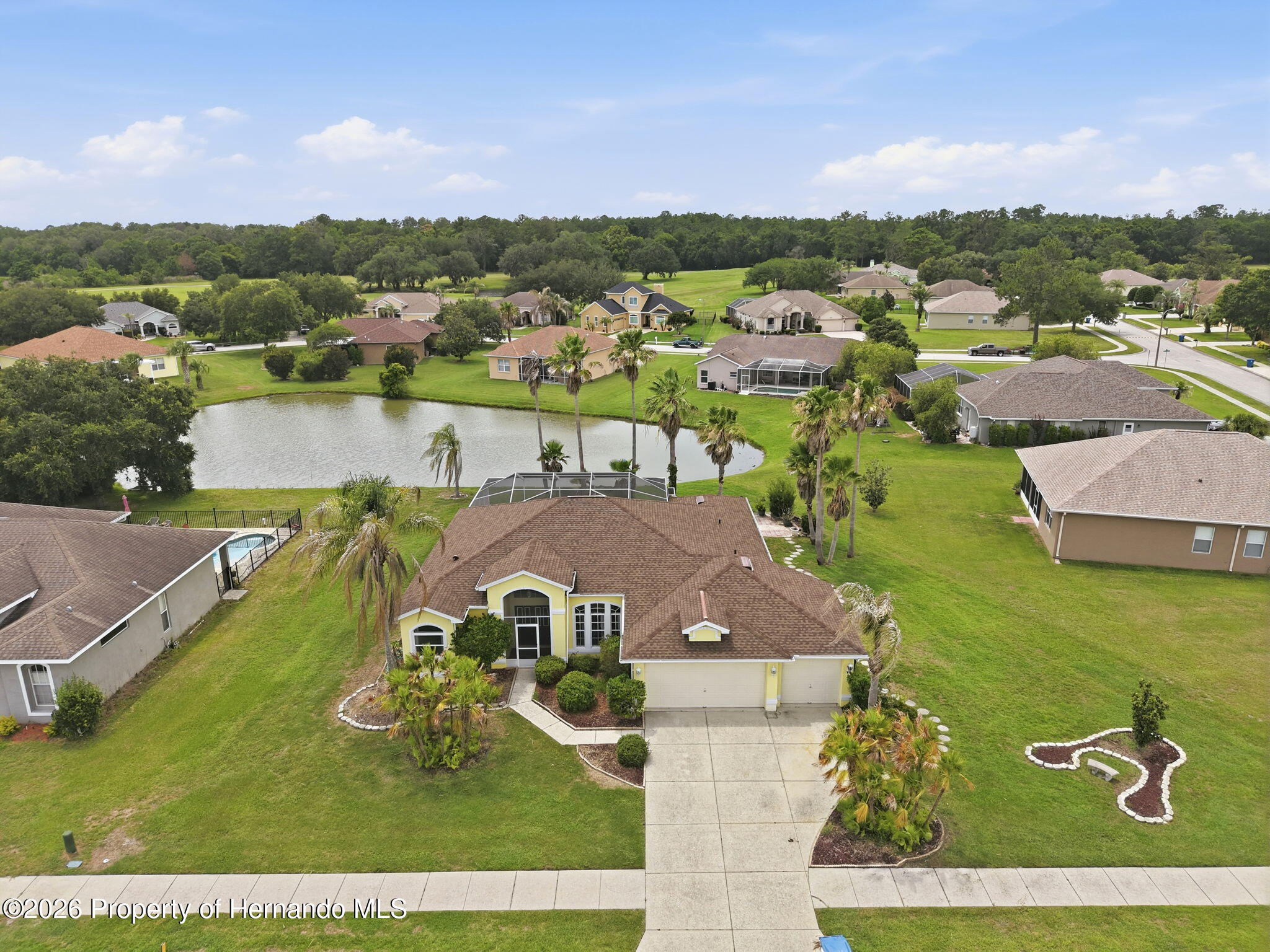18131 Rivard Boulevard Brooksville, FL 34604 - Photo 53 of 66 an aerial view of residential houses with outdoor space
