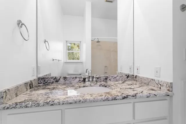 a white sink sitting next to a white sink