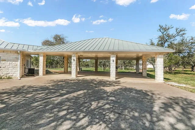 a view of a house with a yard and porch