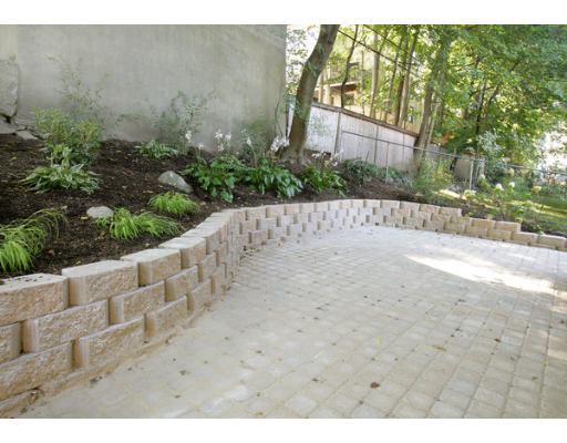 121 University Road, Unit 2 Brookline, MA 02445 - Photo 6 of 6 a view of entryway with wooden fence