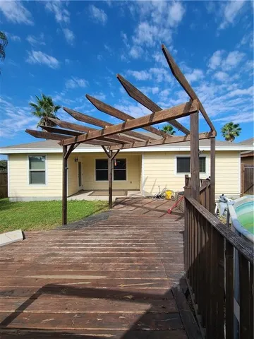 a view of a backyard with sitting area