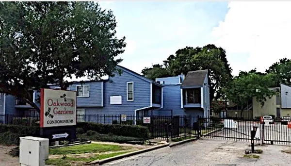 a front view of a house with sitting area
