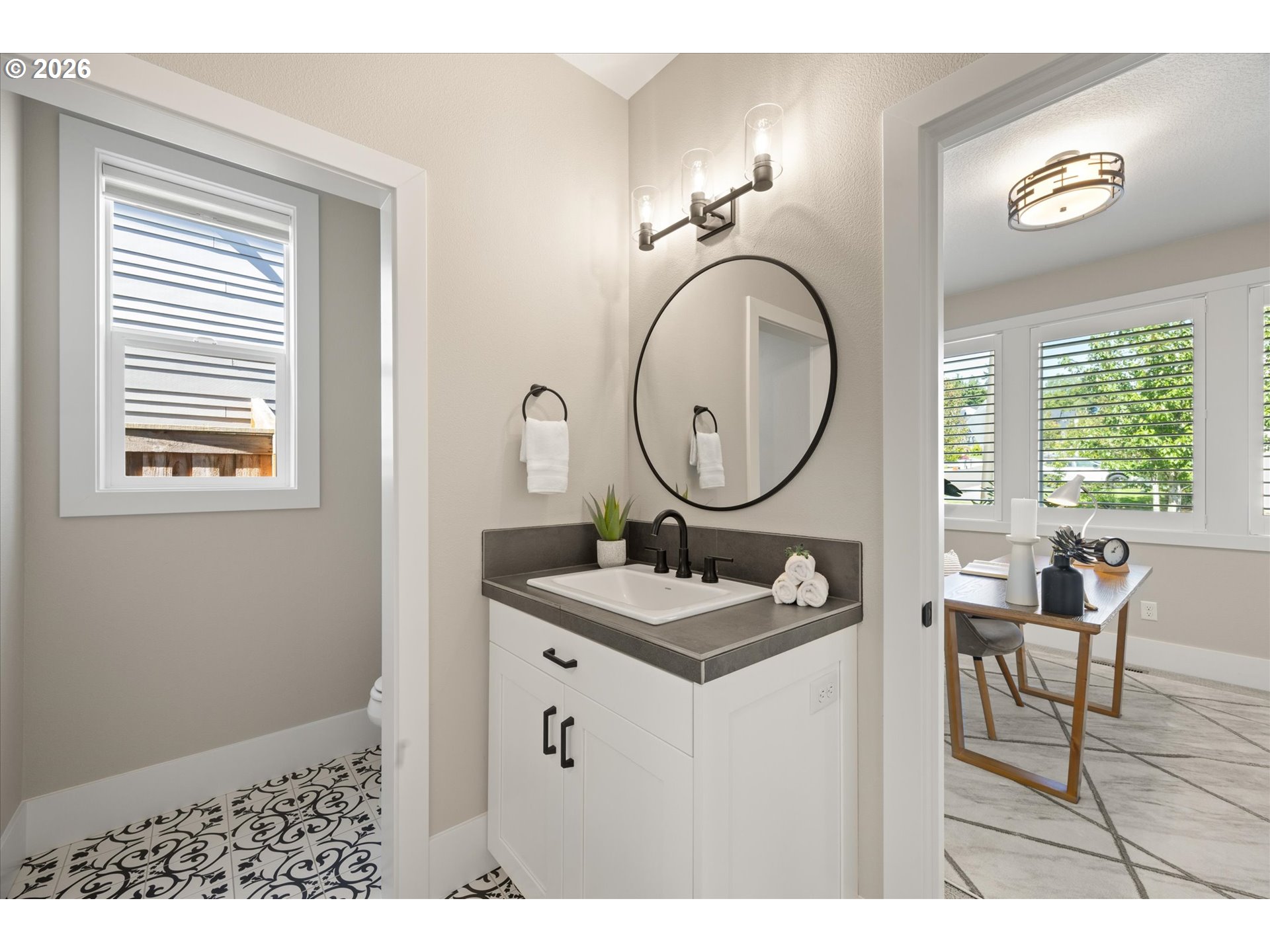 14551 Southwest 153rd Avenue Portland, OR 97224 - Photo 8 of 45 a bathroom with a sink a mirror and a window
