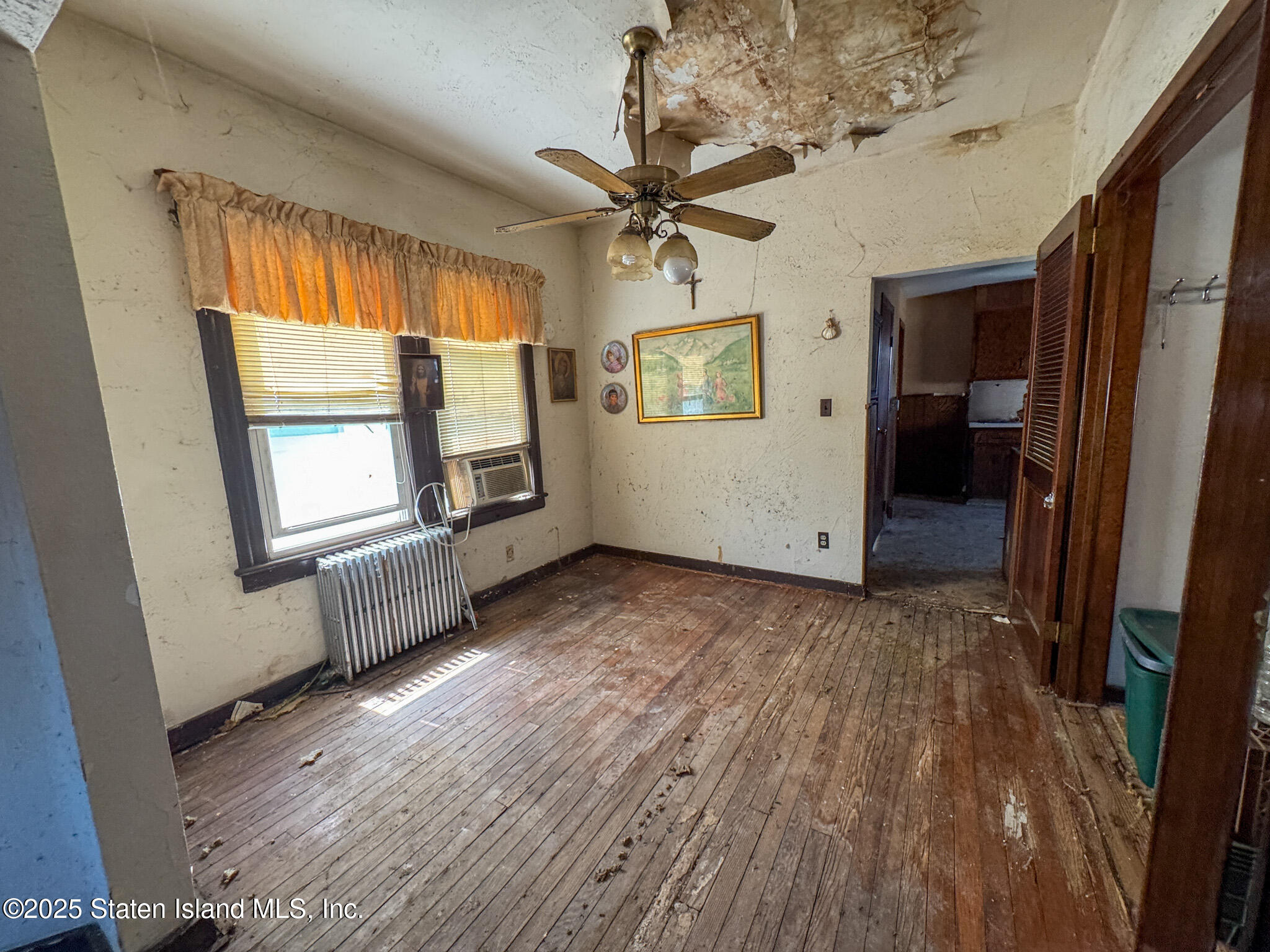 14 Van Riper Street Staten Island, NY 10302 - Photo 7 of 11 wooden floor in an empty room with a window