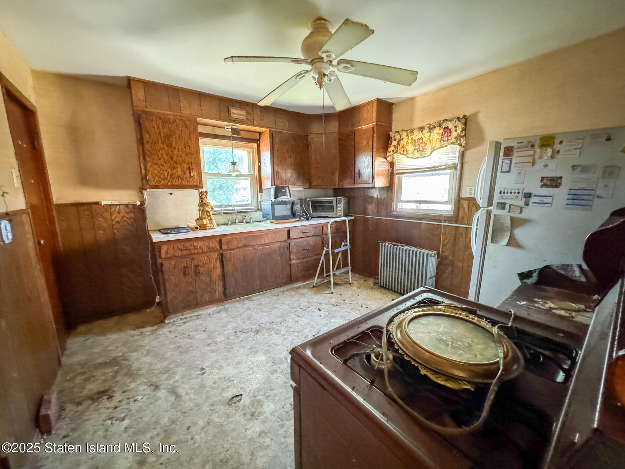 14 Van Riper Street Staten Island, NY 10302 - Photo 9 of 11 a kitchen with stainless steel appliances granite countertop a sink stove and refrigerator