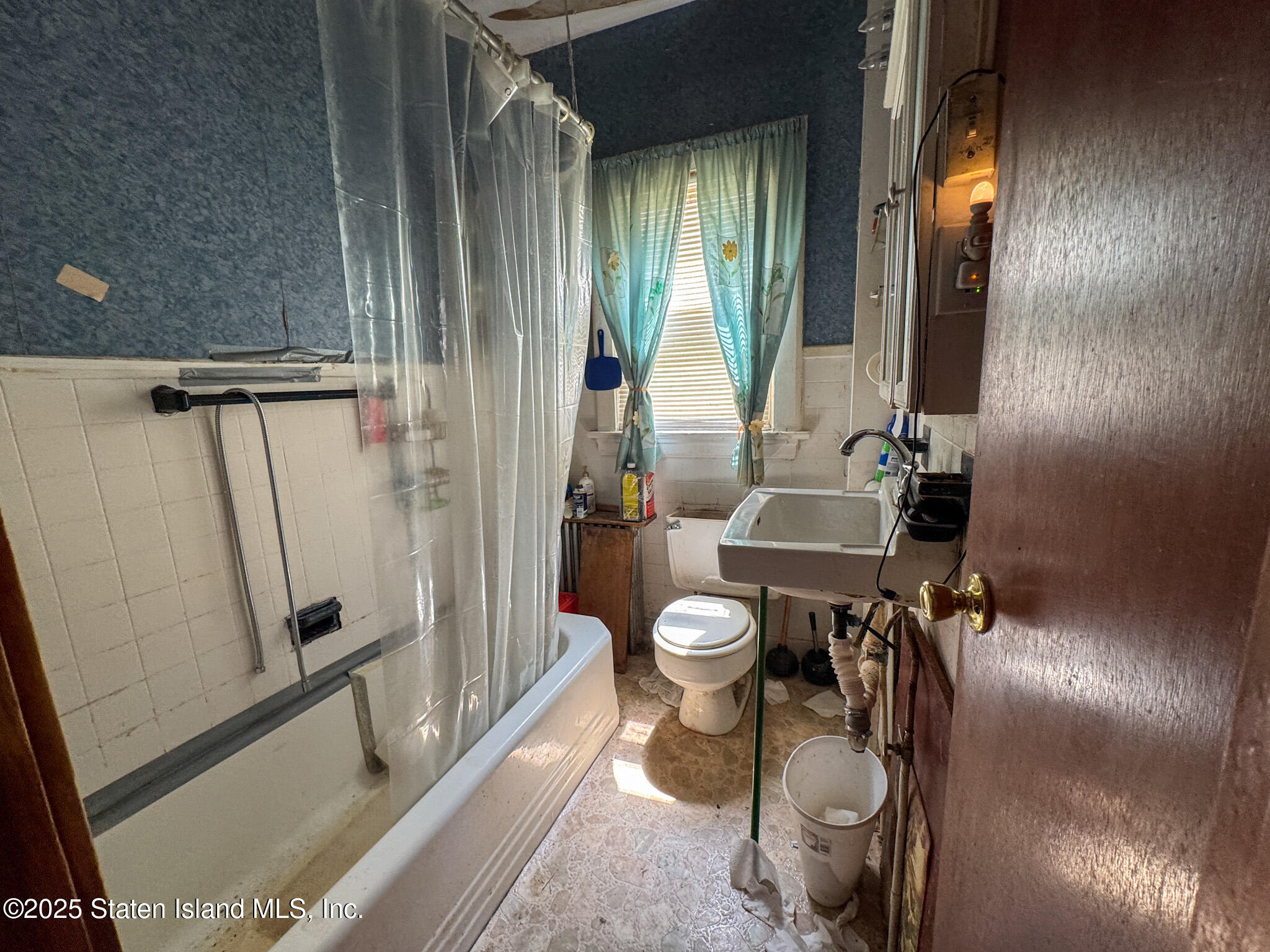 14 Van Riper Street Staten Island, NY 10302 - Photo 10 of 11 a bathroom with a toilet and a shower