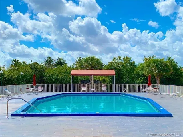 a view of a swimming pool with a patio