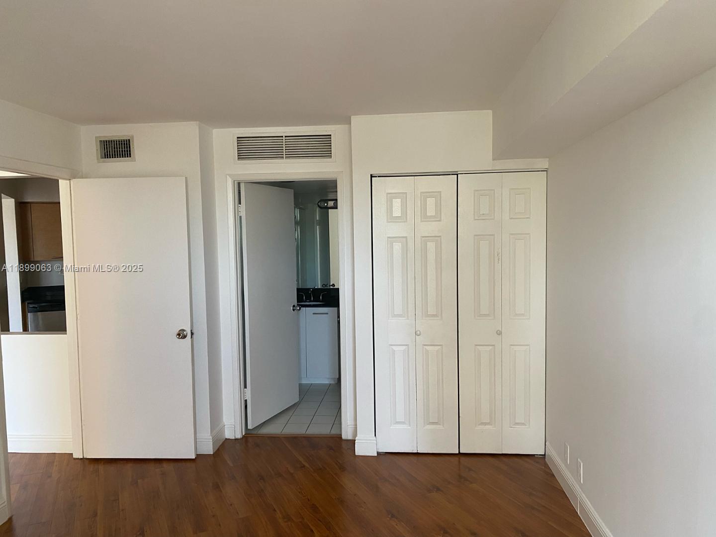 3300 Northeast 191st Street, Unit 416 Aventura, FL 33180 - Photo 15 of 26 a view of entryway with wooden floor