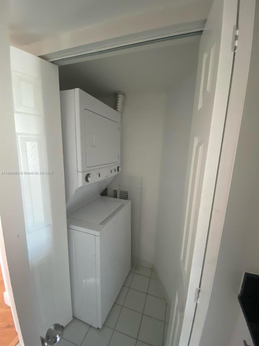 3300 Northeast 191st Street, Unit 416 Aventura, FL 33180 - Photo 19 of 26 a utility room with dryer and washer