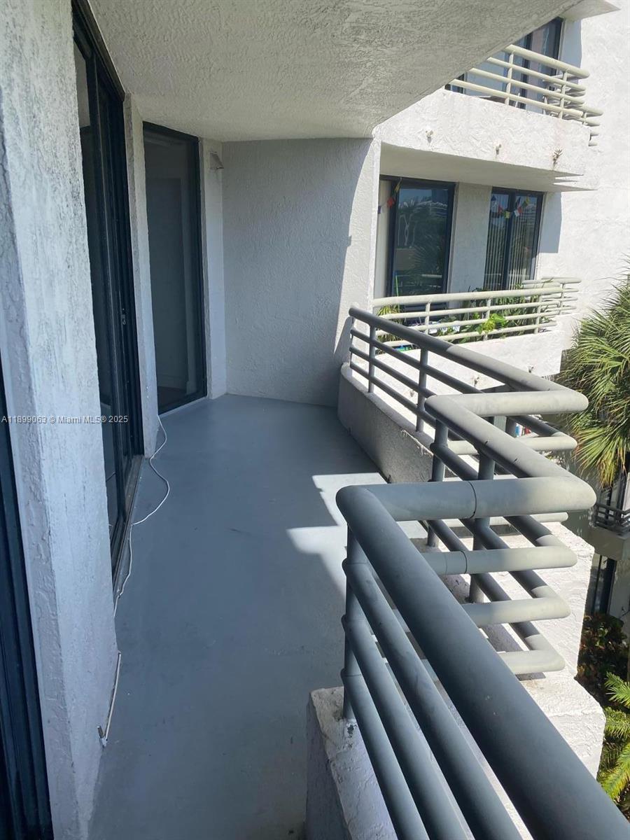 3300 Northeast 191st Street, Unit 416 Aventura, FL 33180 - Photo 20 of 26 a kitchen with furniture and natural light