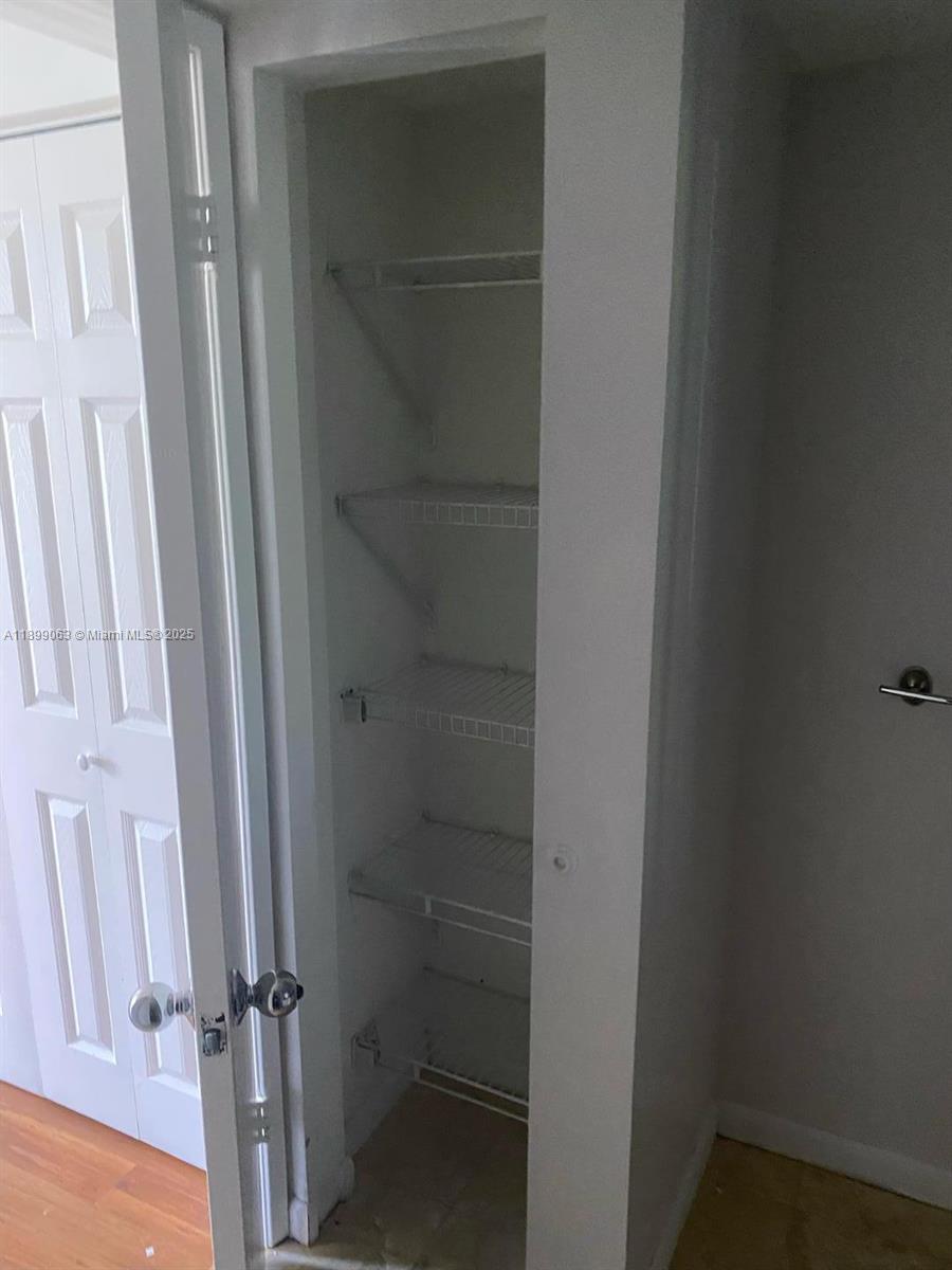 3300 Northeast 191st Street, Unit 416 Aventura, FL 33180 - Photo 10 of 26 a bathroom with a glass door shower and toilet