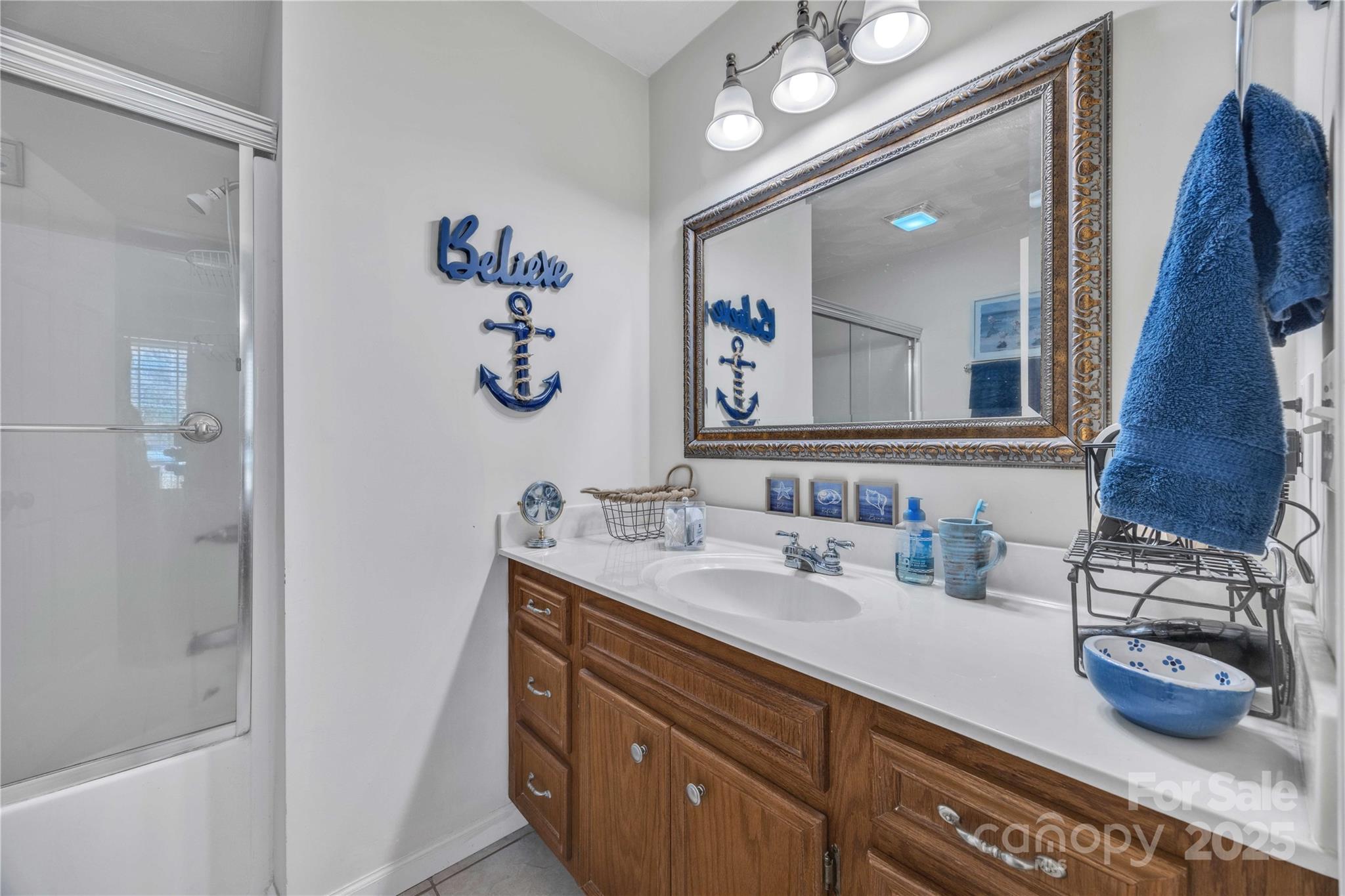 57 Riverview Road Taylorsville, NC 28681 - Photo 21 of 30 a bathroom with a sink and a mirror